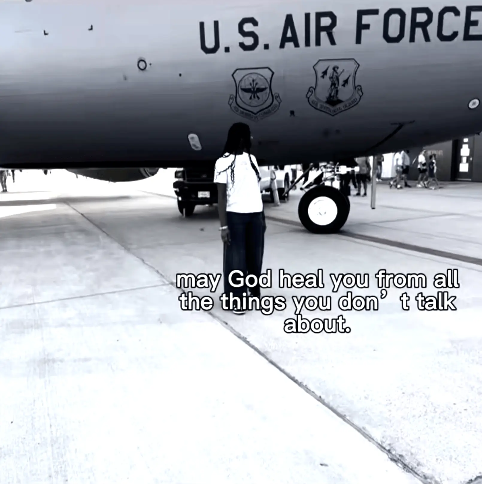 Grace A. standing by U.S. Air Force jet